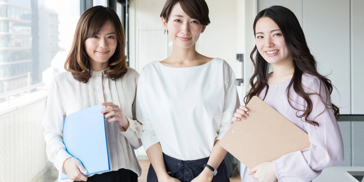 Three professional women in office